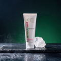 Neutrant Women cream deodorant tube on wet slate with a raw alum crystal